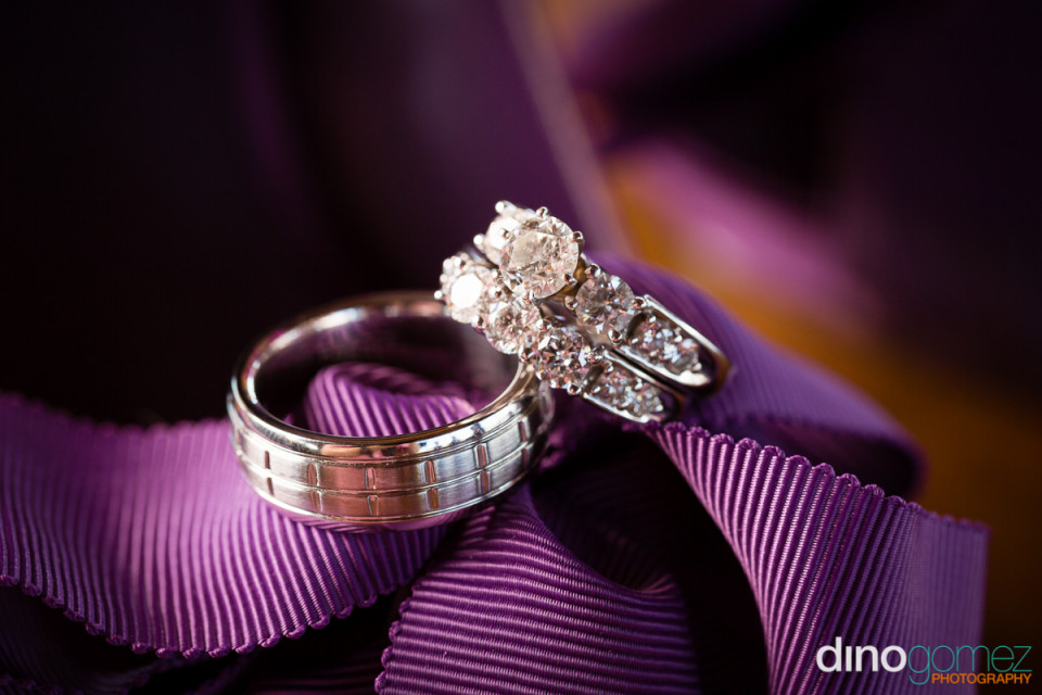 His And Hers Wedding Bands On A Purple Material In Mexico