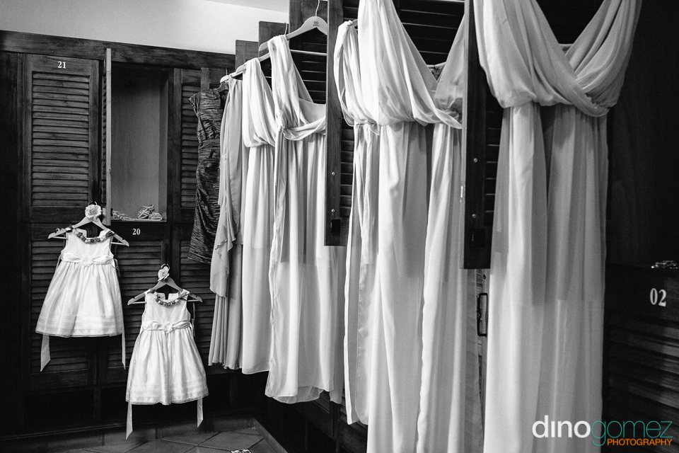 The Bridesmaids Dresses Hanging Up With The Flower Girl Dresses In Mexico