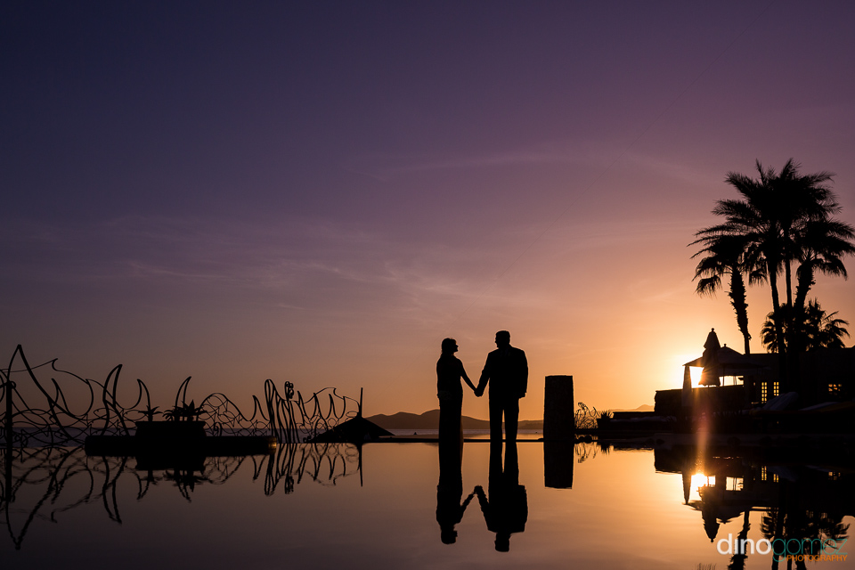 Romantic Sunset Silhouette After Renewing Their Wedding Vows