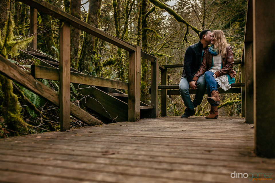 Couple snuggling on their engagement session in Portland