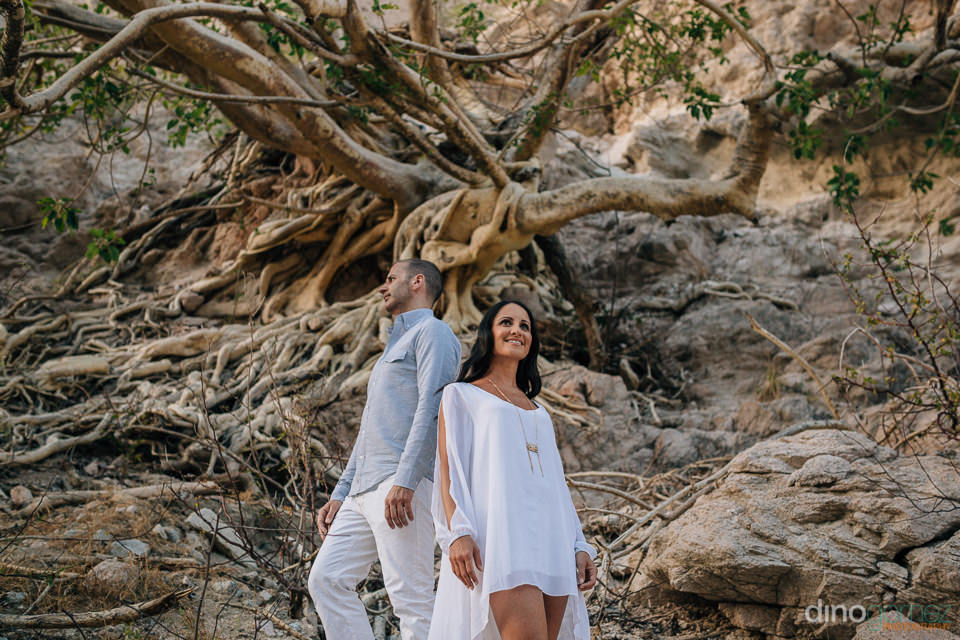 couple standing next to a mountain for their engagemnt session by Cabo Photographer Dino Gomez