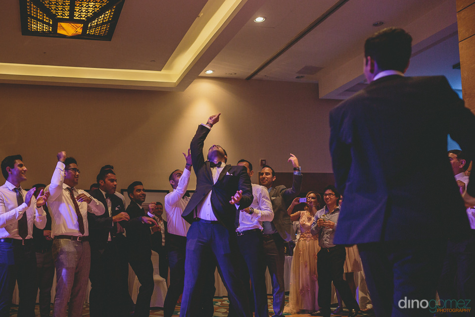 Groomsmen Catches Bridal Garter In Ballroom Of Hyatt Ziva Los Ca