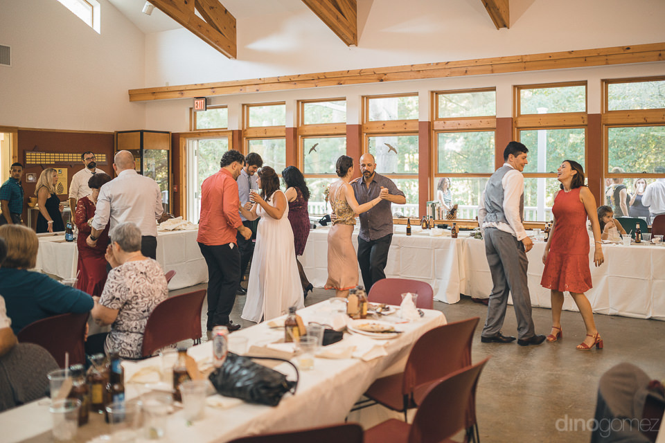 newlyweds dancing with their wedding guests in new york nature c