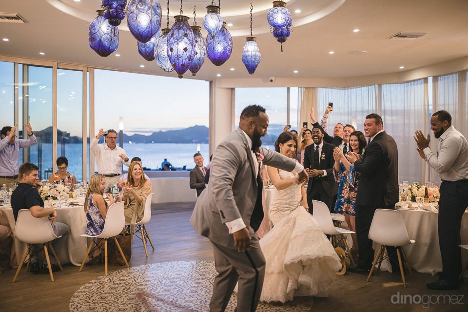 Newlyweds dancing when entering the reception - Kimber & Julius' Warmsley Wedding