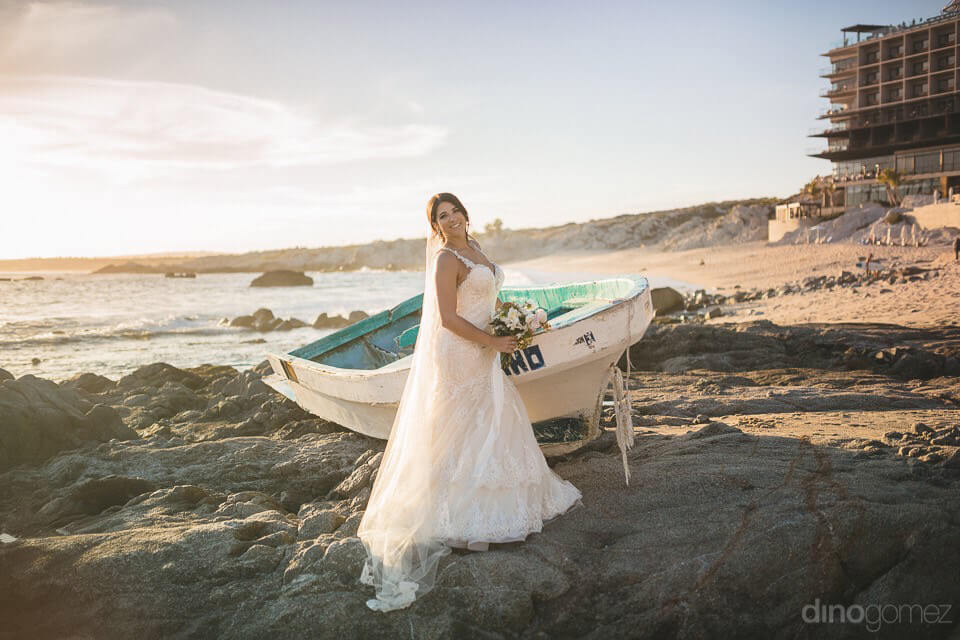 Photo Of The Bride And The Boat On The Beach - Kimber & Julius' Warmsley Wedding