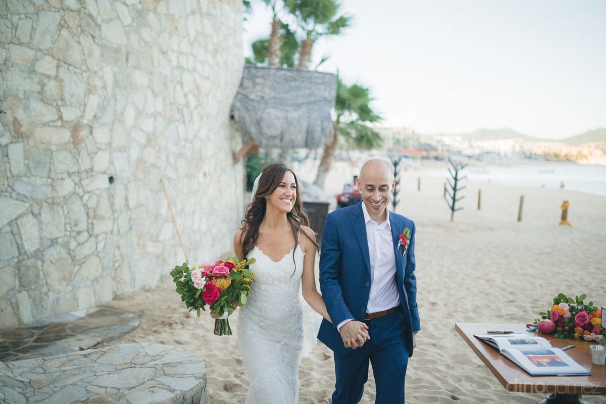 Lovely Newly Married Couple Is Happily Walking Holding Hands At The Beachside- Nikki And David