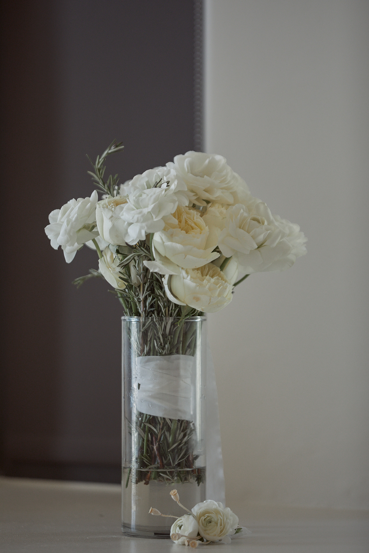 A Vase Filled With White Flowers On Top Of A Table.