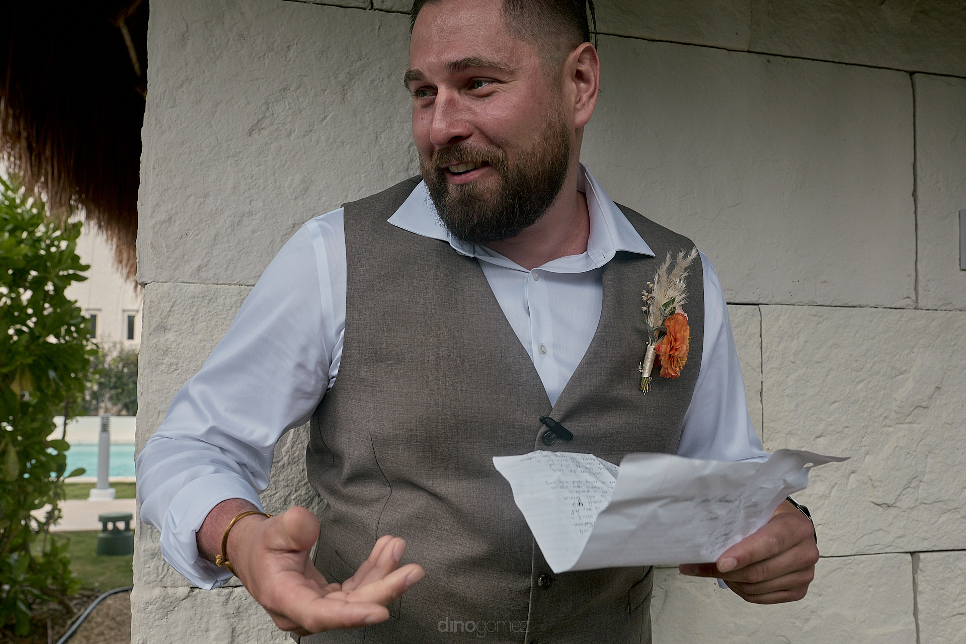 a man holding a piece of paper with a carrot on it.