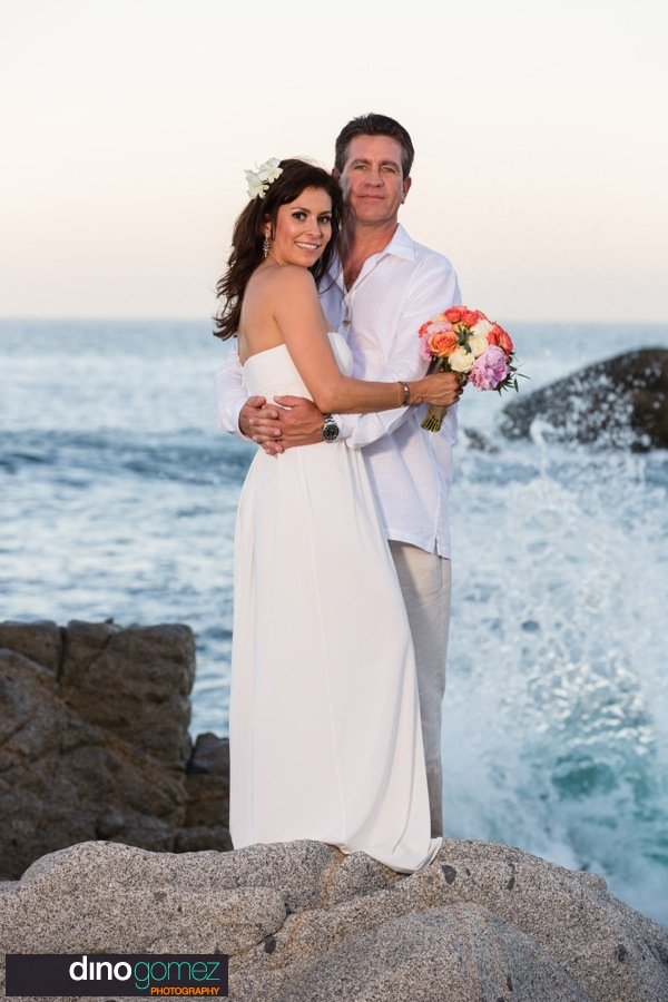 Wedding Anniversary Couple Standing On Rocks On The Beach
